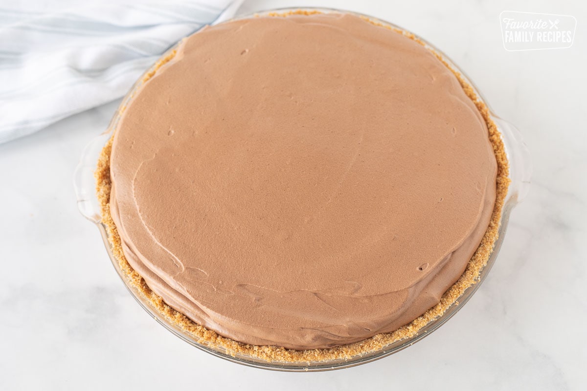 Smooth chocolate top of a Costco Peanut Butter Chocolate Cream Pie.