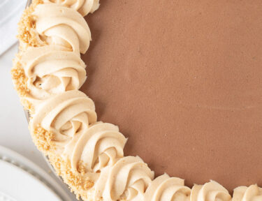 Costco Peanut Butter Chocolate Cream Pie decorated with graham cracker crumbles.