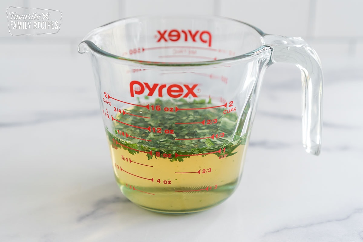 water, rice vinegar, sugar, salt, and fresh cilantro in a large glass measuring cup