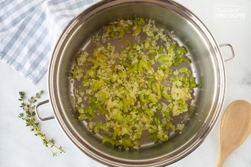 Pot of celery, garlic and onion sautéed with oil for Ham and Bean Soup.