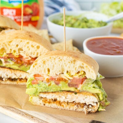 Chicken Torta cut in half with a toothpick on top.