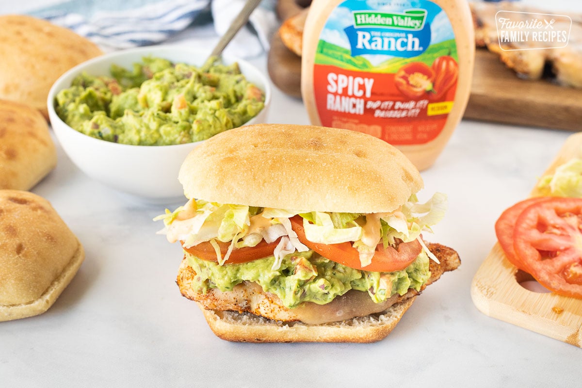 Chicken Torta with chicken, pepper jack cheese, guacamole, lettuce, sliced tomatoes and spicy ranch.