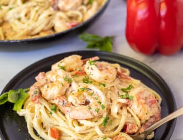 Plate with Creamy Cajun Shrimp Pasta and fork swirled with noodles.
