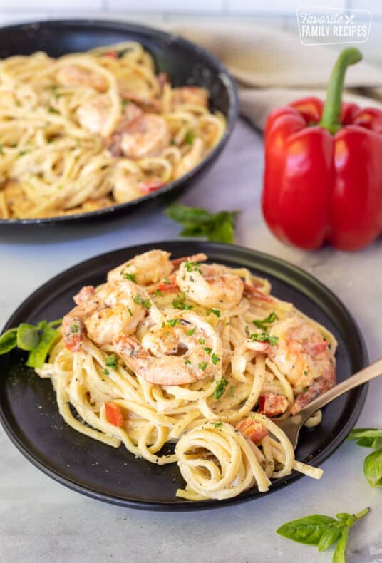 Plate with Creamy Cajun Shrimp Pasta and fork swirled with noodles.