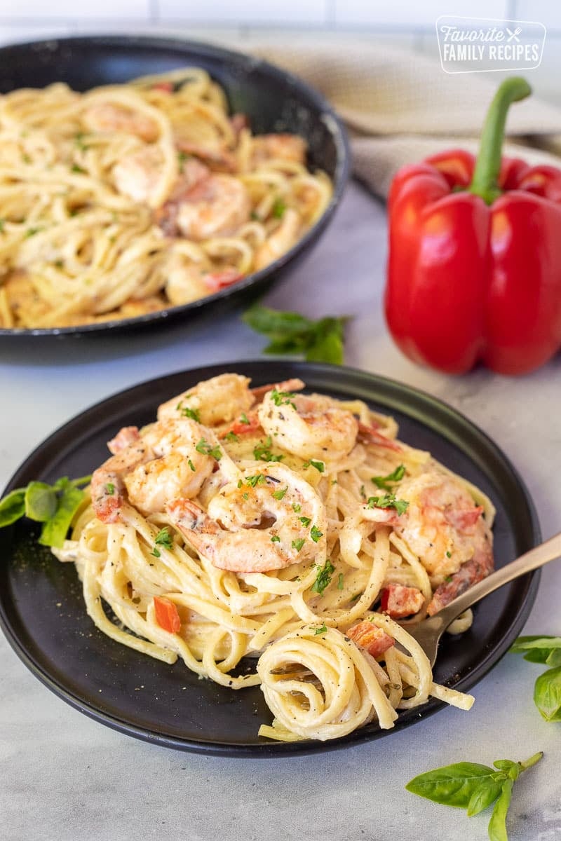 Plate with Creamy Cajun Shrimp Pasta and fork swirled with noodles.