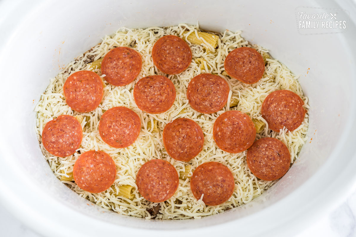 Cheese and pepperoni layer in crockpot pizza casserole