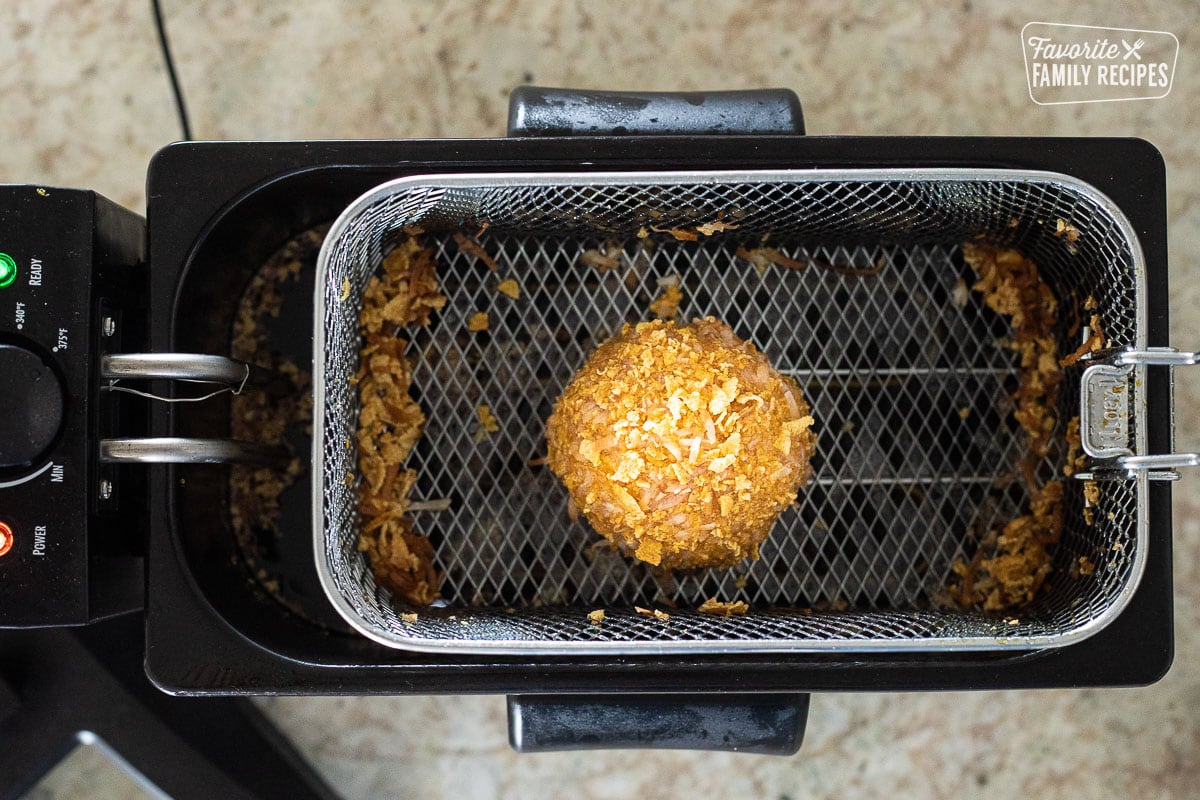 Ball of Fried Ice Cream in the deep fryer basket.