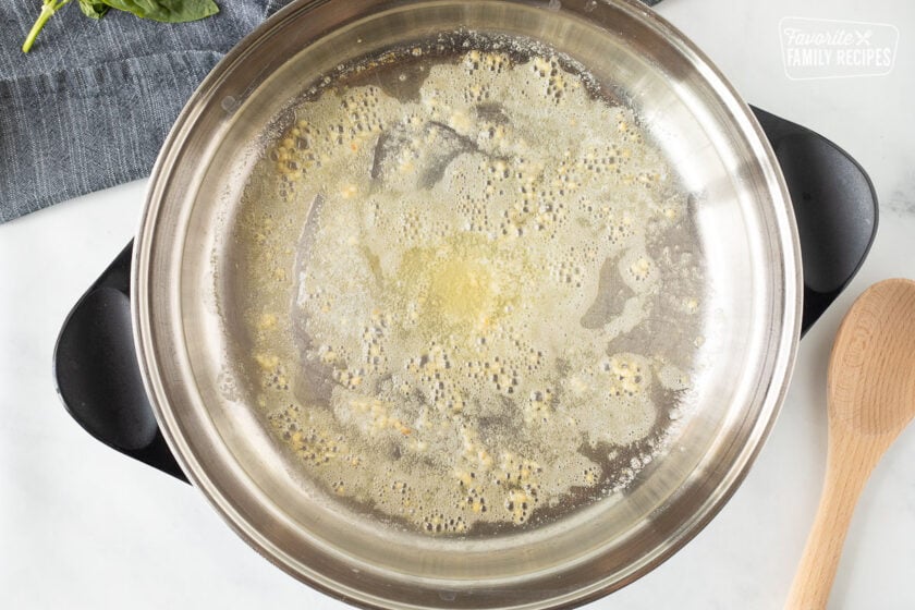 Pot with butter and garlic for One Pot Creamy Garlic Noodles.