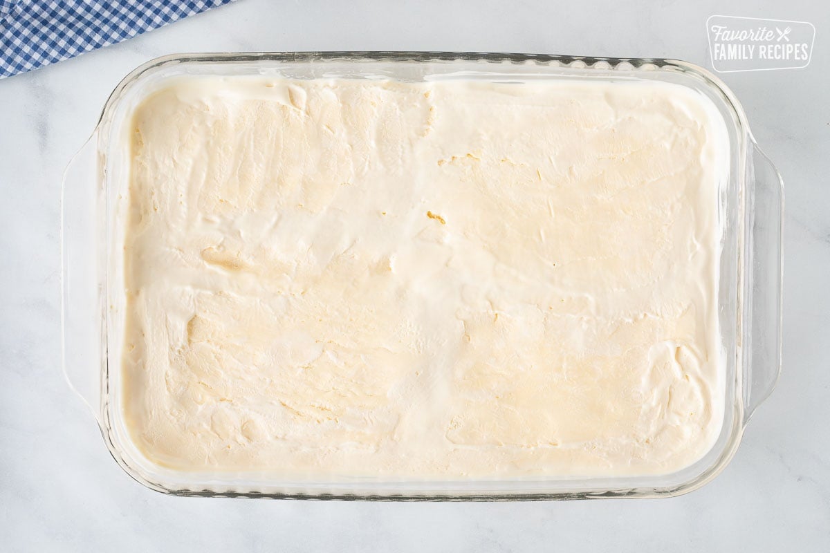 Glass rectangle dish with flattened ice cream for Banana Split Dessert.