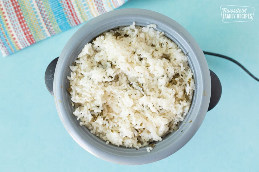 Rice cooker with cooked cilantro lime rice for Mexican Chicken Casserole.
