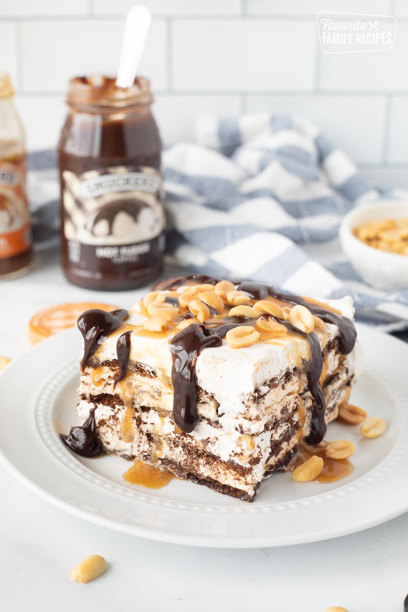 Ice Cream Sandwich Cake with hot fudge, caramel sauce and peanuts.