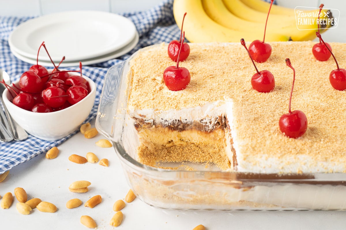Banana Split dessert in a dish with cherries on top.