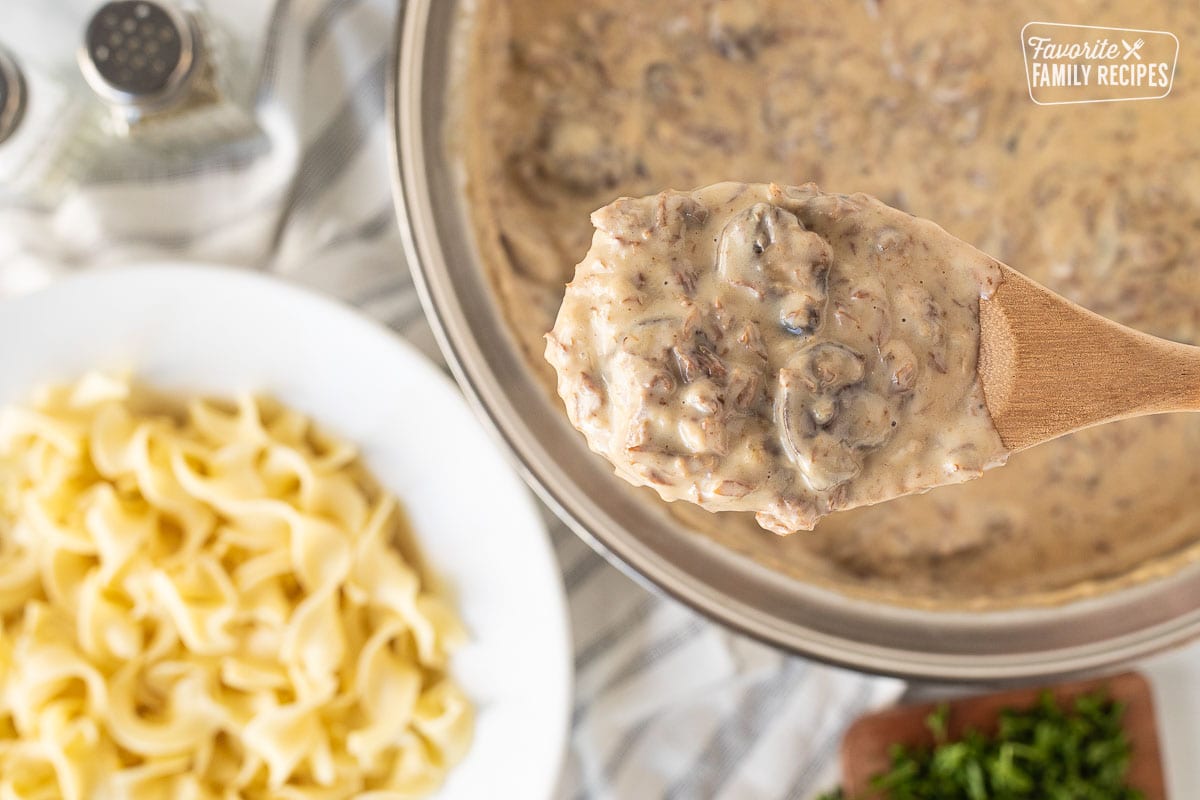 Wooden spoon with Easy Beef Stroganoff.