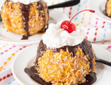 Fried Ice Cream with whipped cream and a cherry on top.