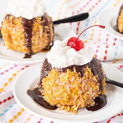Fried Ice Cream with whipped cream and a cherry on top.