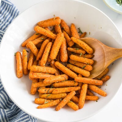 Cooked baby carrots in a bowl