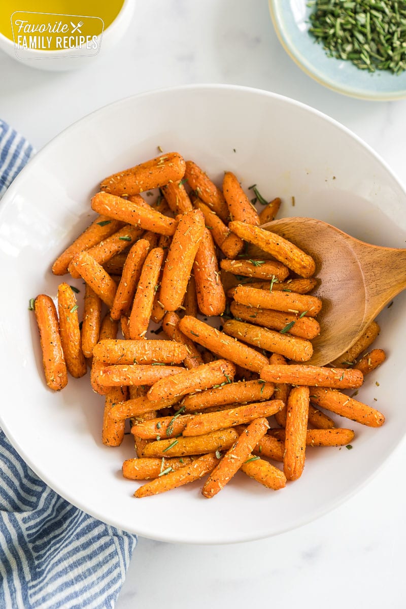 Cooked baby carrots in a bowl