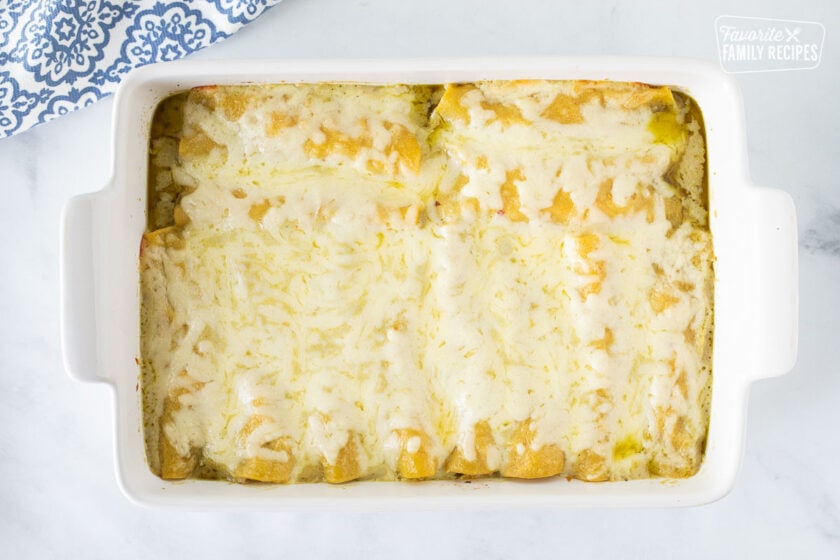 Baked Honey Lime Chicken Enchiladas in a baking dish.