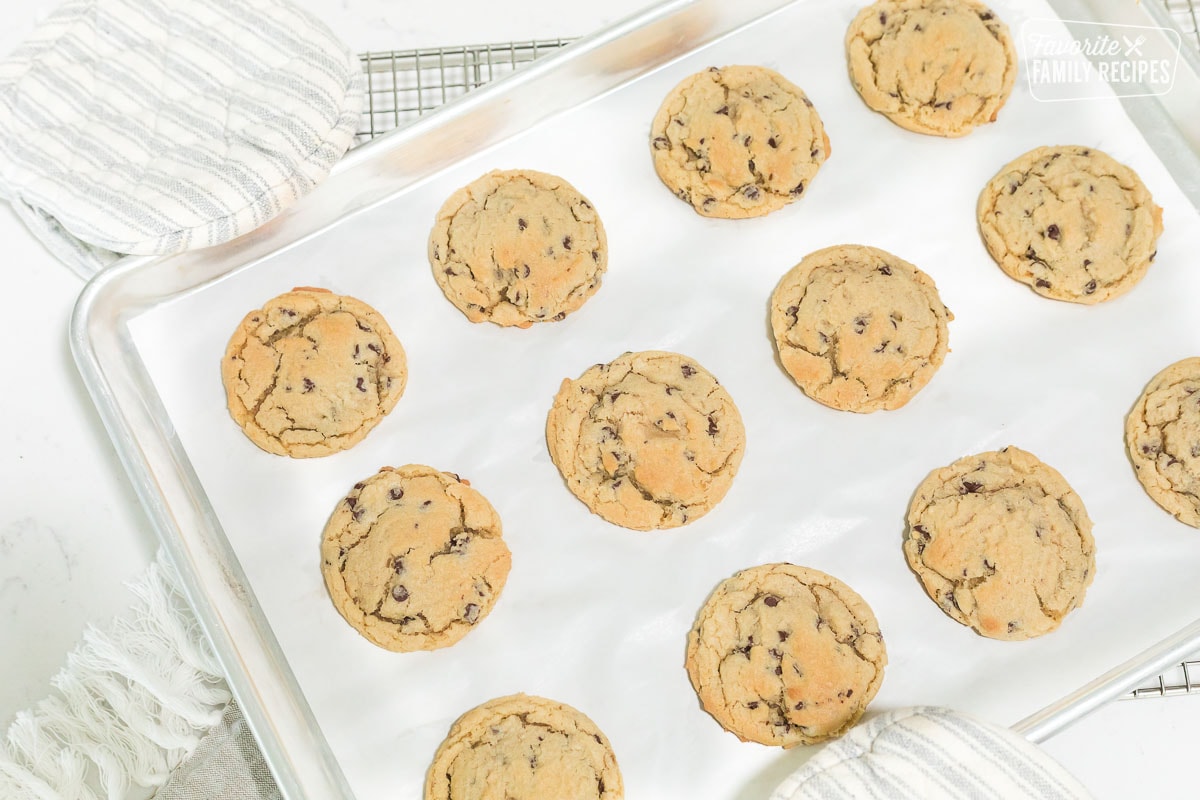Baked chocolate chip cookies on a baking sheet