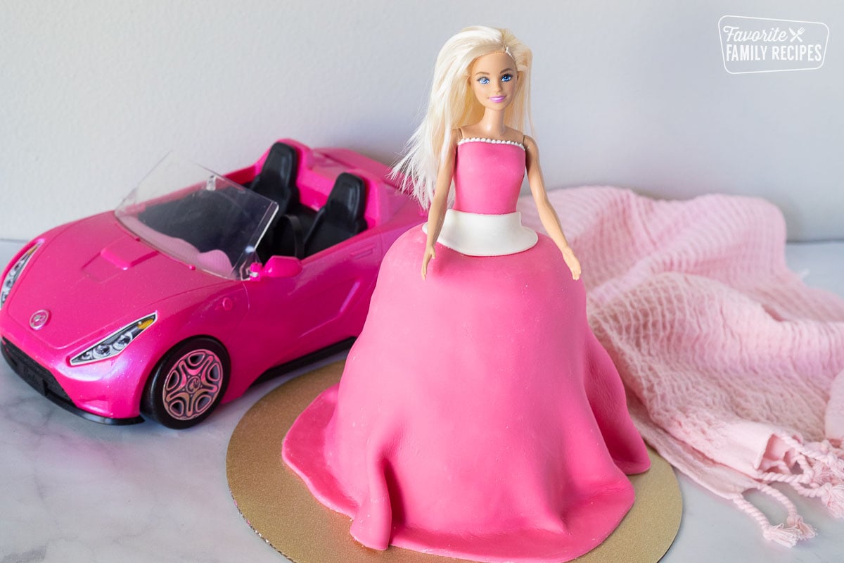 Decorated Barbie Cake in front of Barbie convertible.