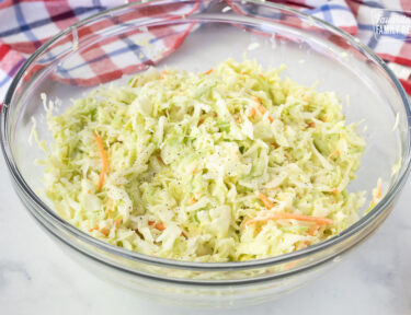 Side view of a large bowl of Coleslaw.