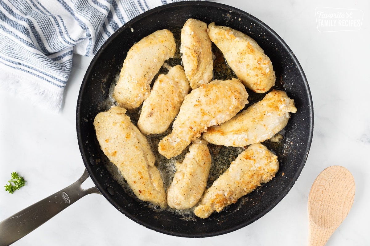 Cooked chicken in a skillet for Chicken Marsala.