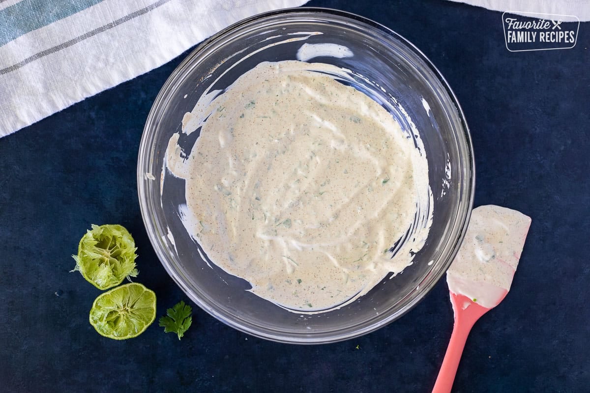 Glass bowl of Cilantro Cream Sauce for Easy Fish Tacos.