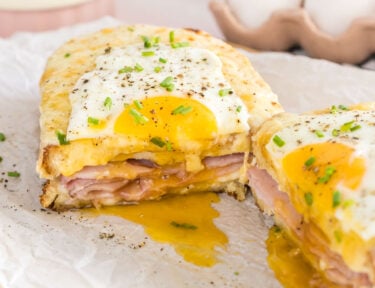 A croque madame sandwich cut in half