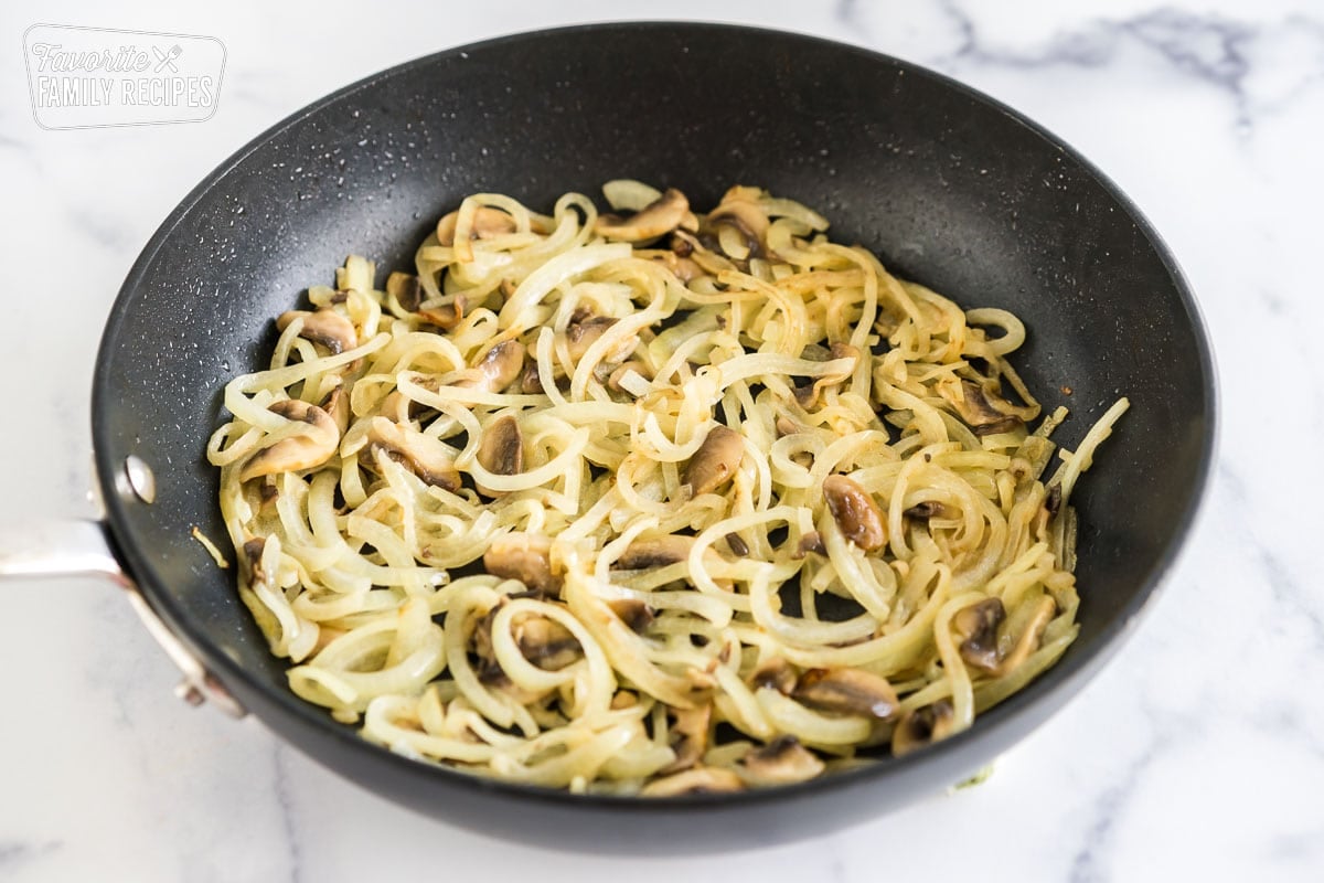 sauteed mushrooms and onions in a skillet