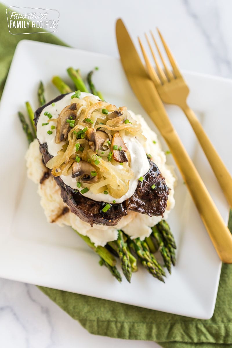 This Fancy Filet Mignon recipe is a winner for Valentine's Day, anniversaries, or birthdays. Looks super fancy, but it's actually simple to make! A fancy filet mignon dinner on a plate.