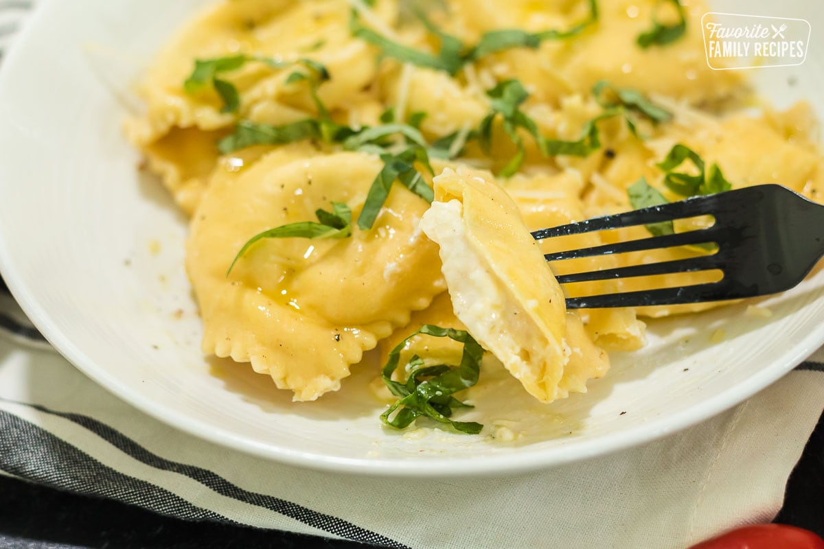 A close up of cheese filled ravioli to show filling
