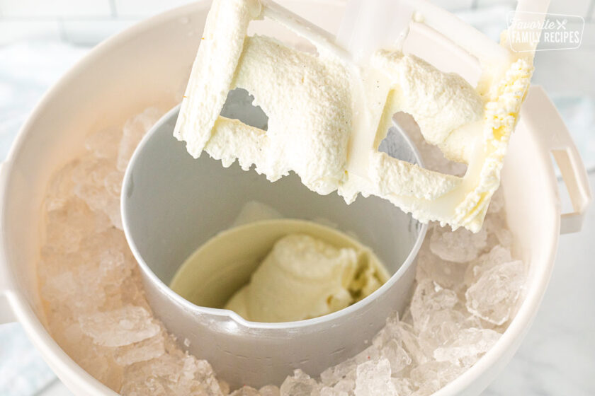 Paddle of ice cream maker with Homemade Vanilla Ice Cream.