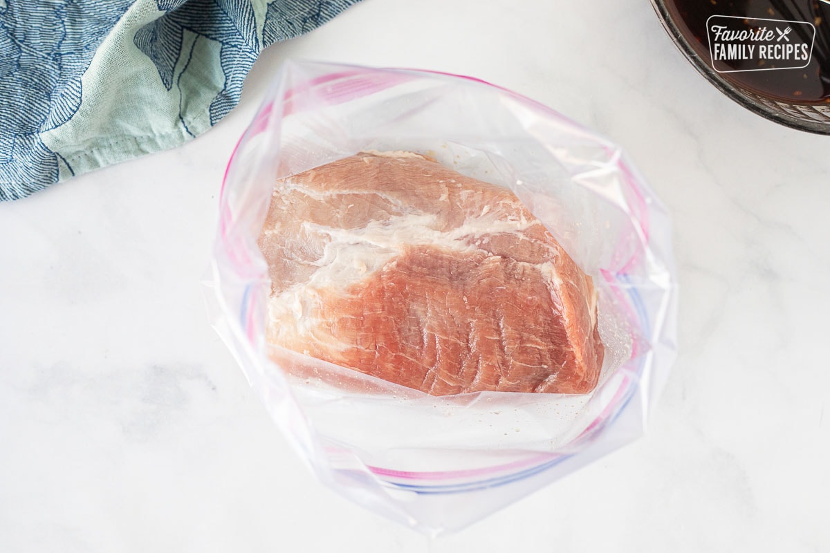 Ziplock bag with trimmed pork tenderloin for Char Siu.