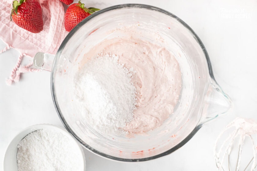 Powdered sugar added to cream cheese mixture for Fresh Strawberry Cake.
