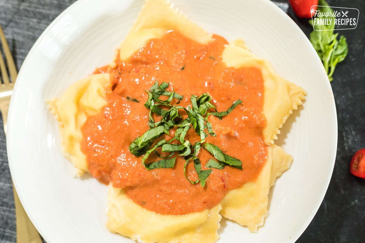Ravioli with a creamy red sauce over the top