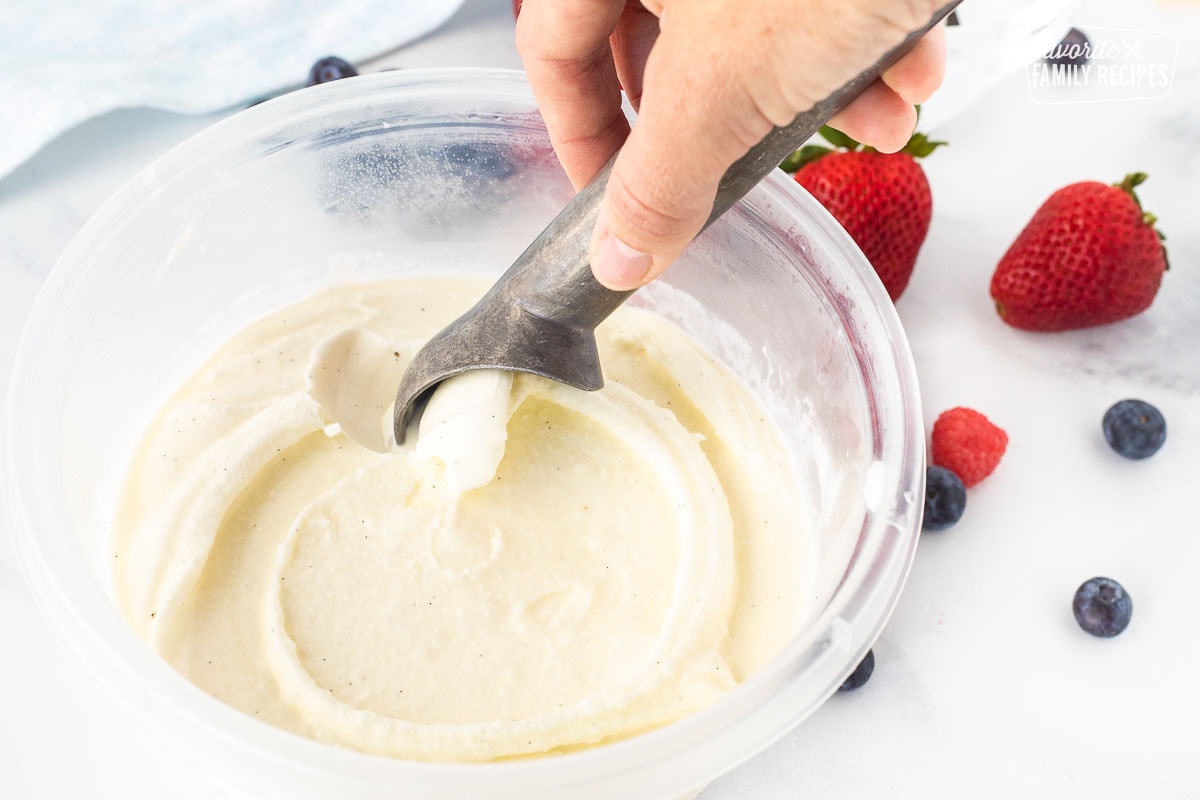 Scooping Homemade Vanilla Ice Cream with an ice cream scoop.