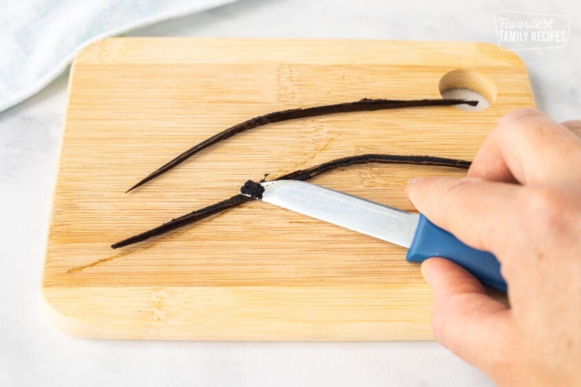 Scraping the seeds from inside the vanilla bean to make Homemade Vanilla Ice Cream.