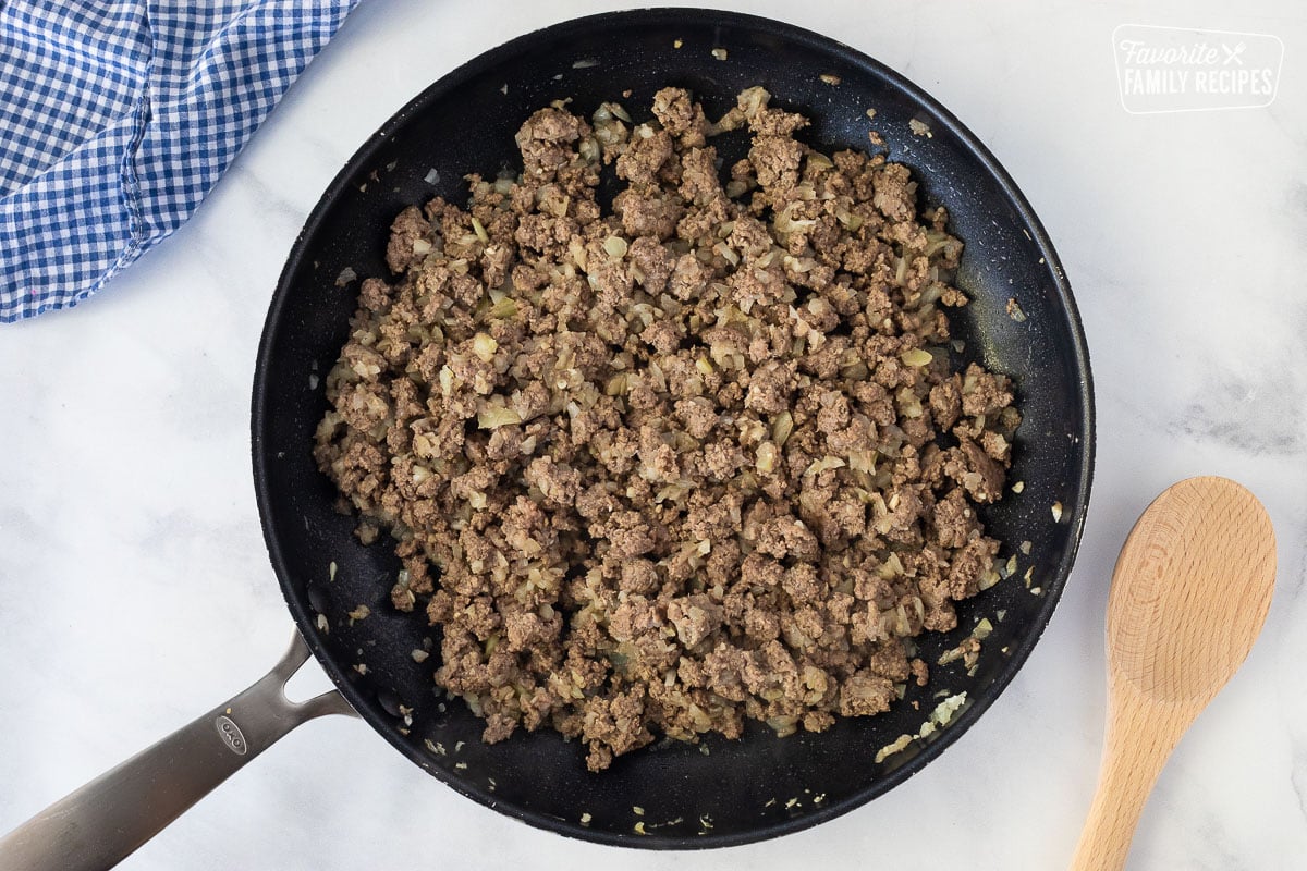 Skillet cooking ground beef with onion and garlic for Baked Beans.