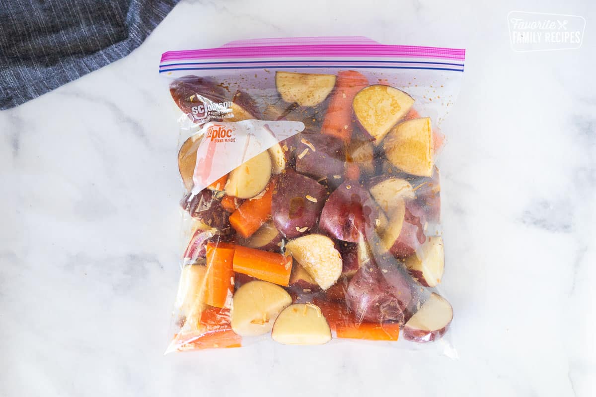 Ziplock bag with cut vegetables with onion soup mix for Crockpot Roast Beef.