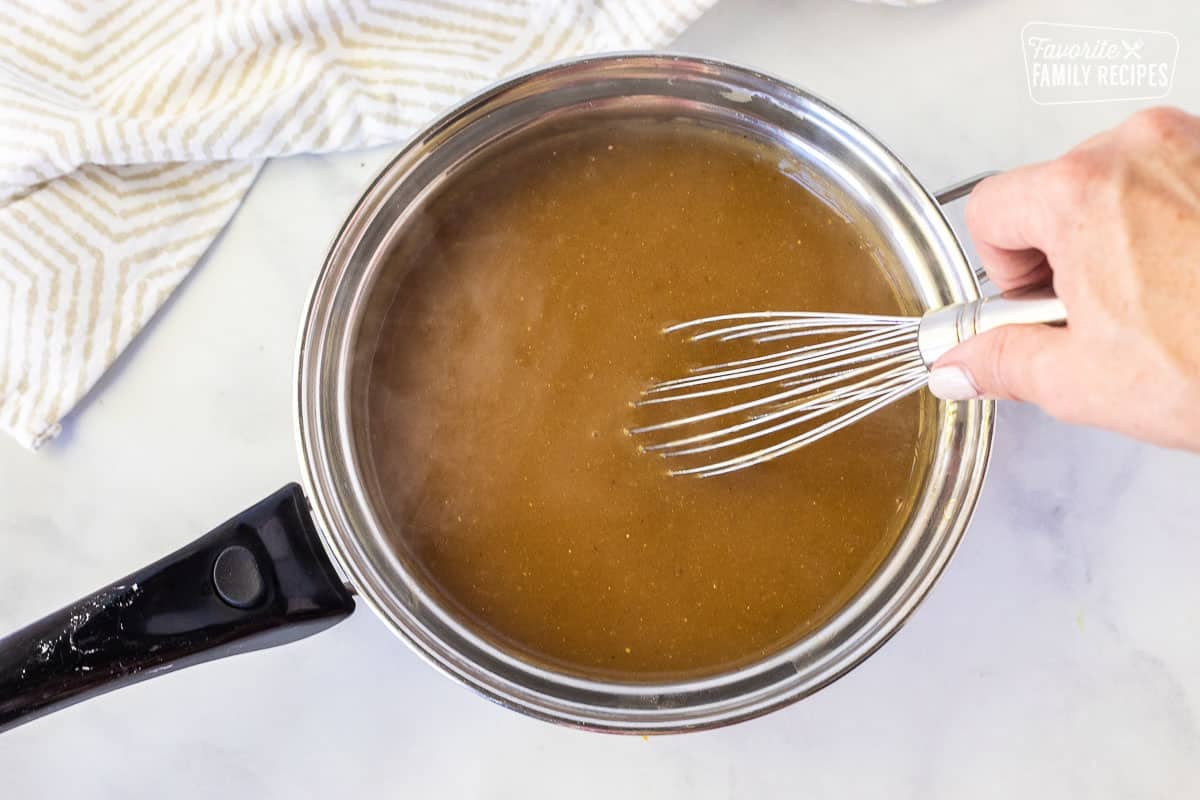 Whisking a pan of Beef Gravy.