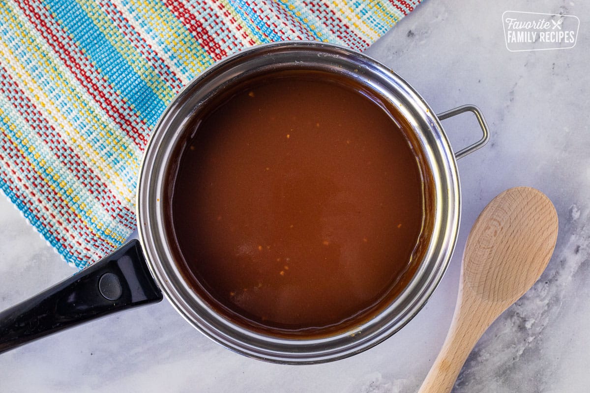 Sauce pan of Homemade BBQ Sauce for Pulled Pork Nachos.