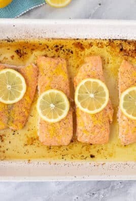 Four pieces of Baked Lemon Salmon in a baking dish.