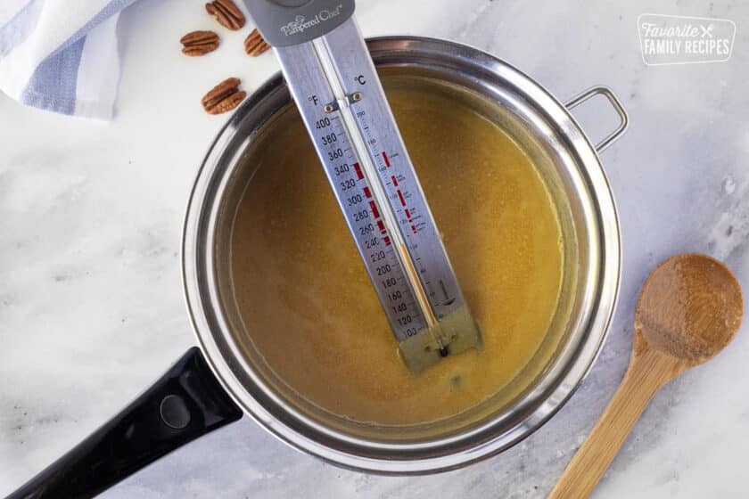 Candy thermometer in a pan for Pecan Pralines.