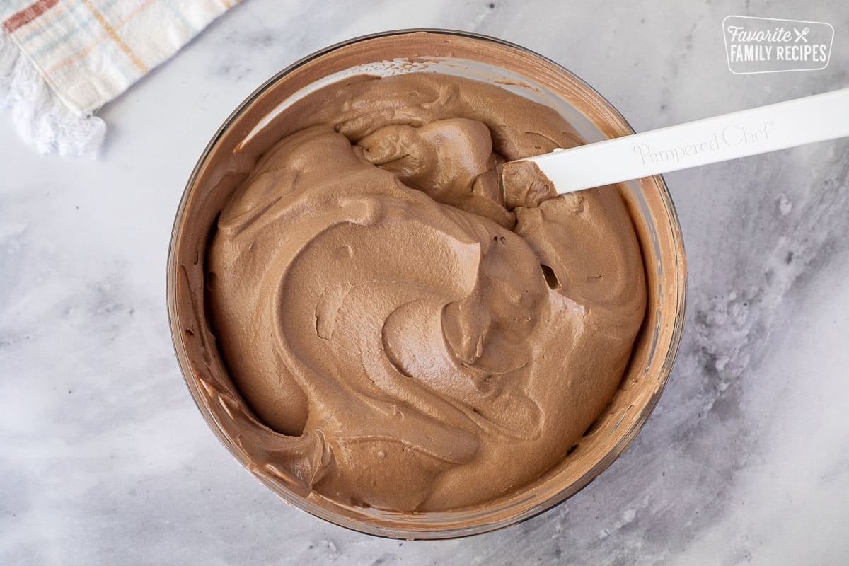 Glass bowl of Chocolate Satin Pie filling and a spatula.