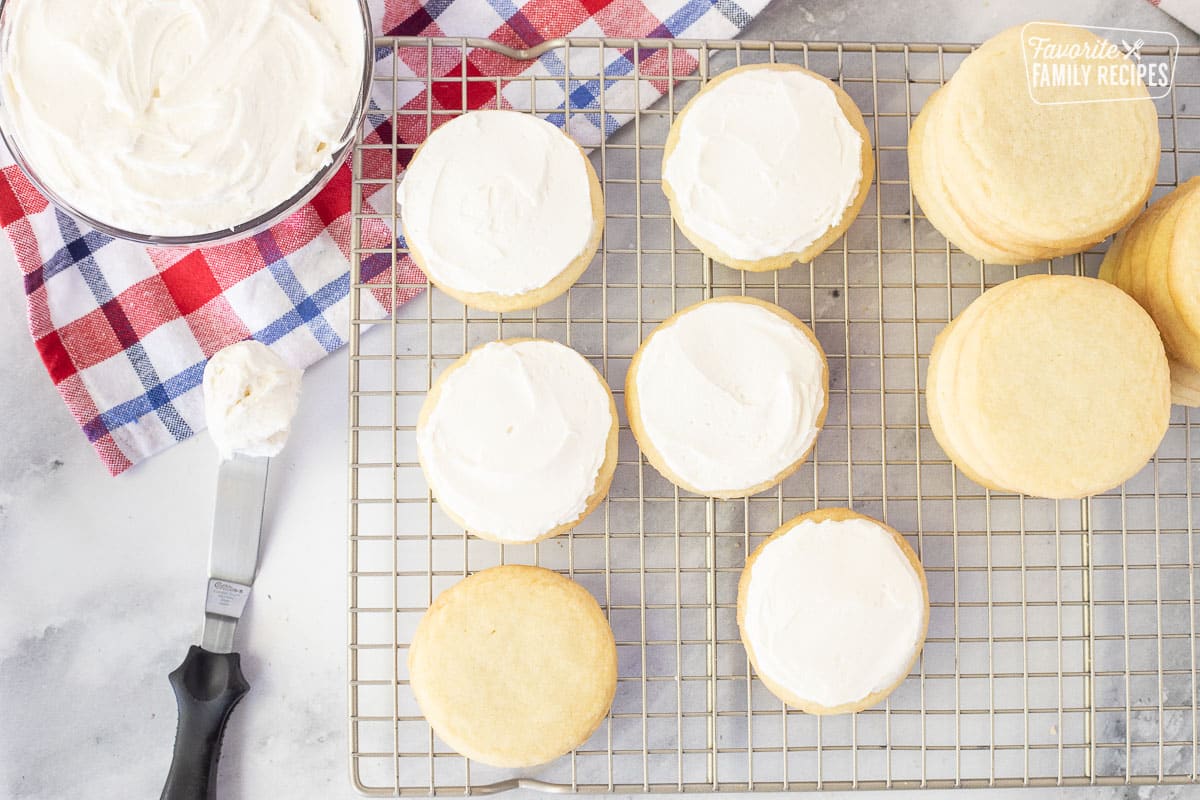 Cooking rack with frosted sugar cookies with cream cheese frosting for 4th of July Cookies.