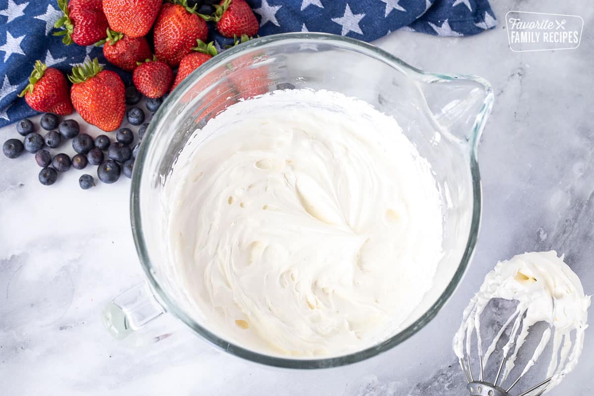 Mixing bowl with cream cheese and Cool Whip frosting for 4th of July Cake.