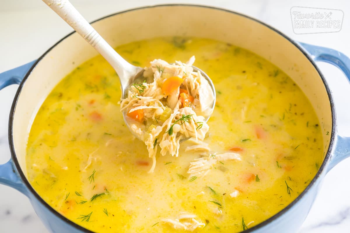 Ladle full of greek lemon chicken soup.