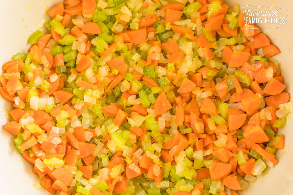 Celery, carrots, and onion cooking in a large pot