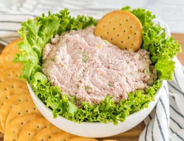 Ham salad in a bowl with lettuce and crackers