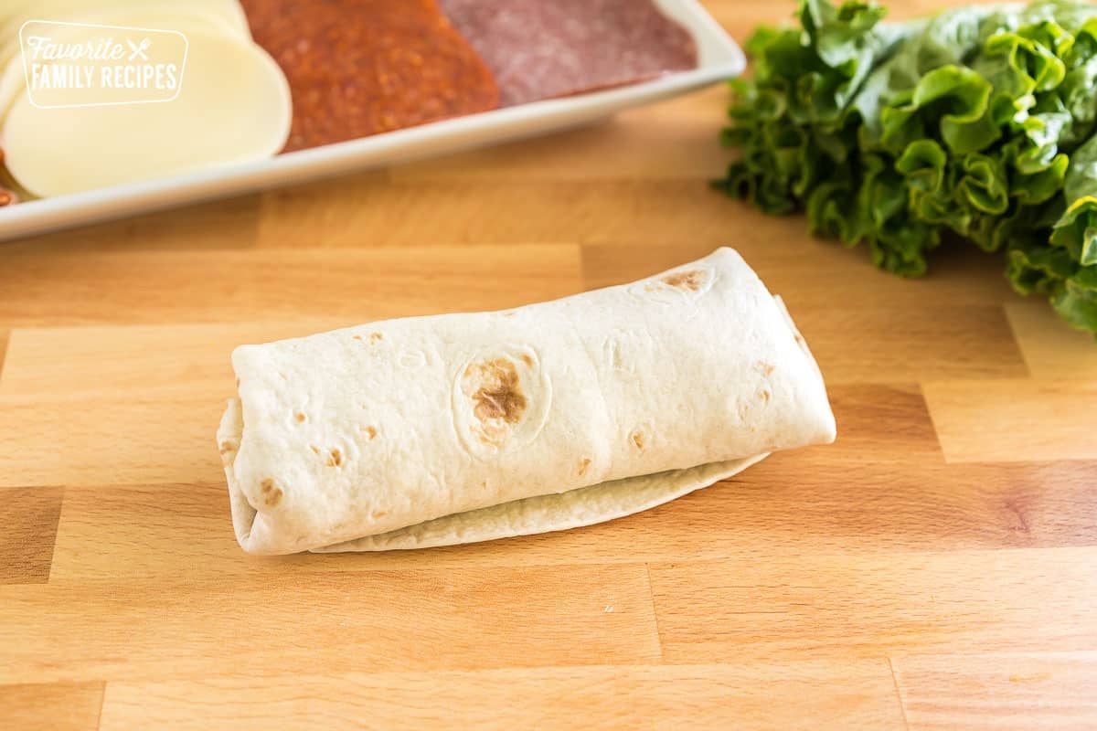 https://www.favfamilyrecipes.com/wp-content/uploads/2023/06/Italian-Sandwich-Wraps-rolled-from-side.jpg